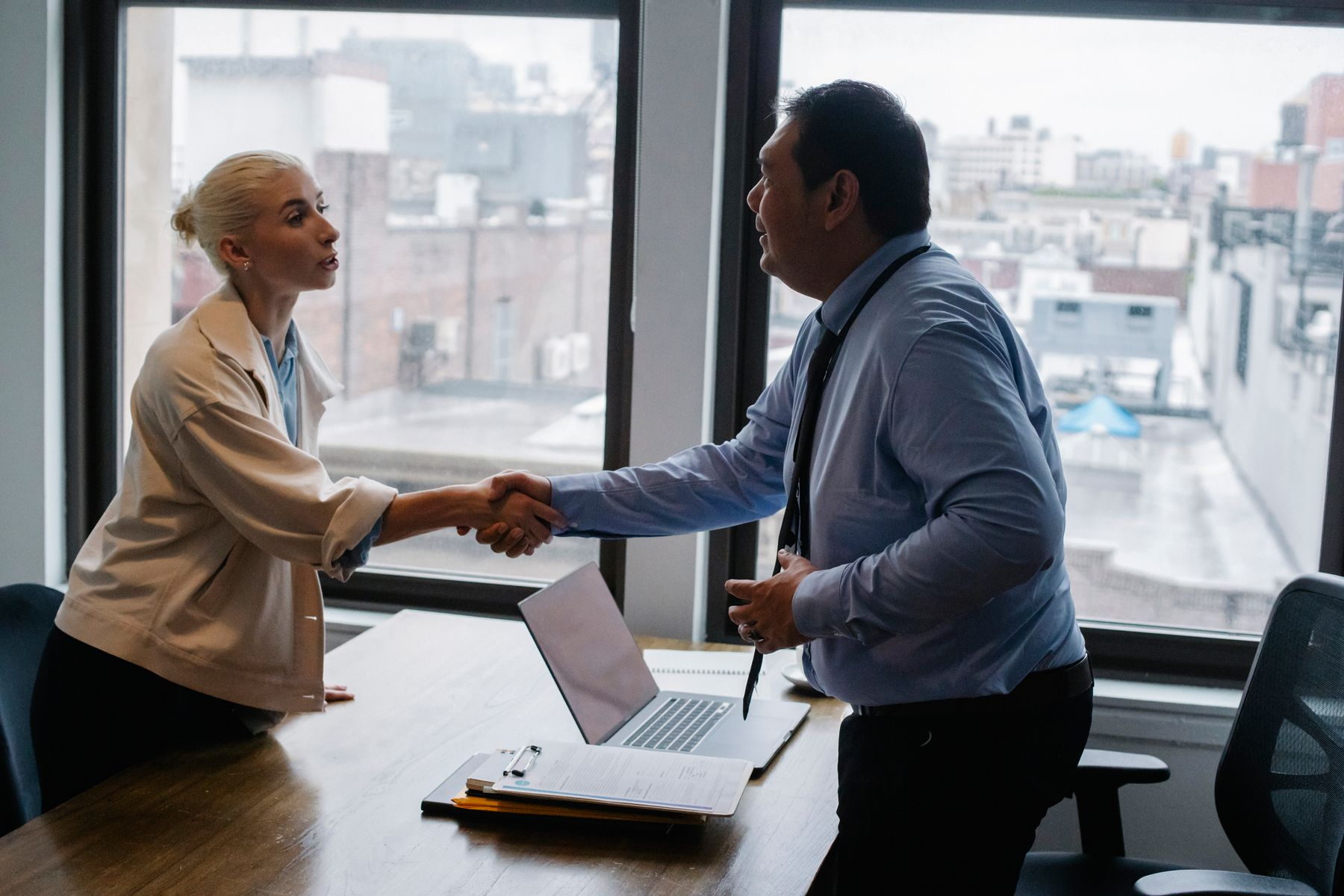 Business handshake concluding a funding agreement